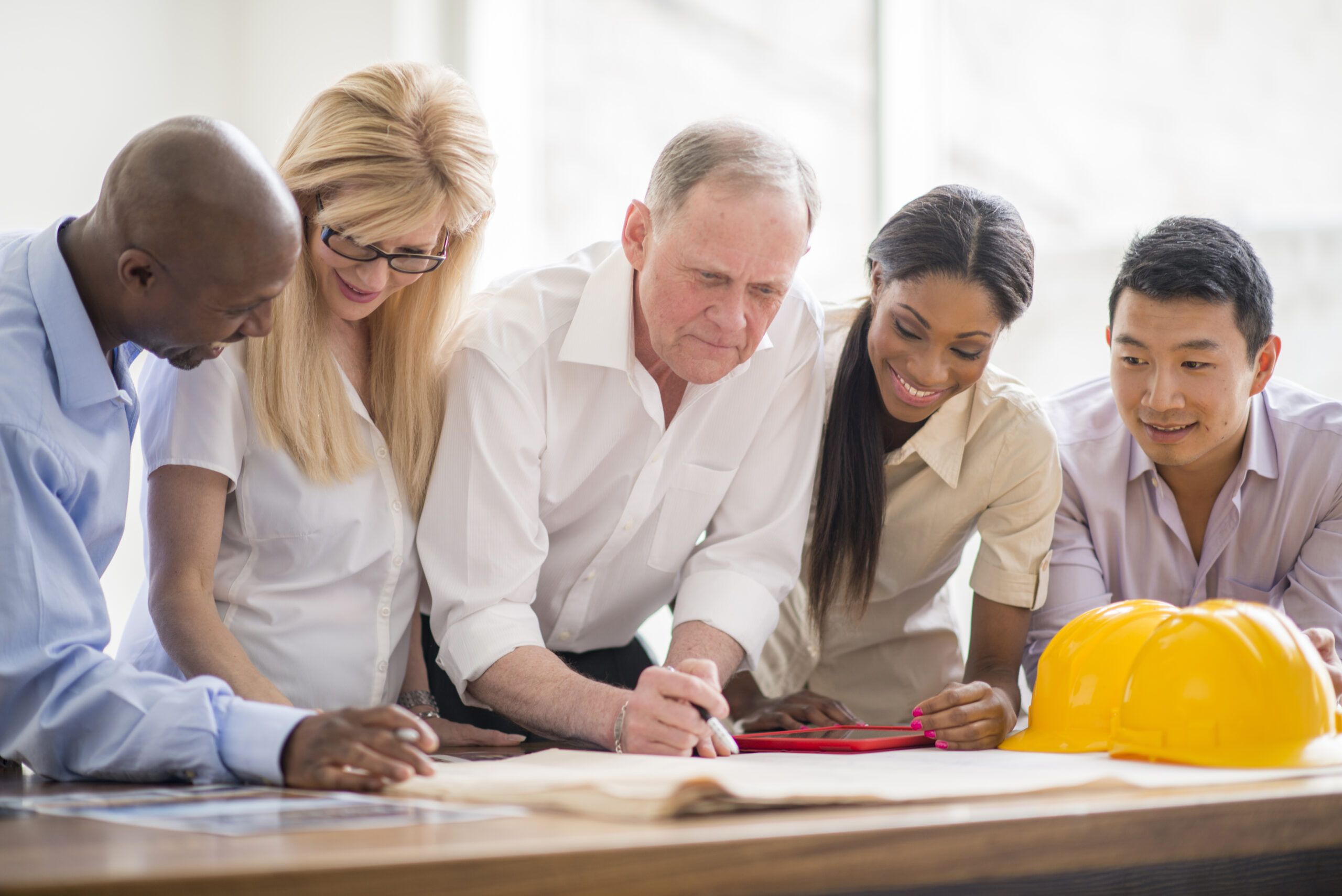 Contractors and Designers Working on the Blueprint